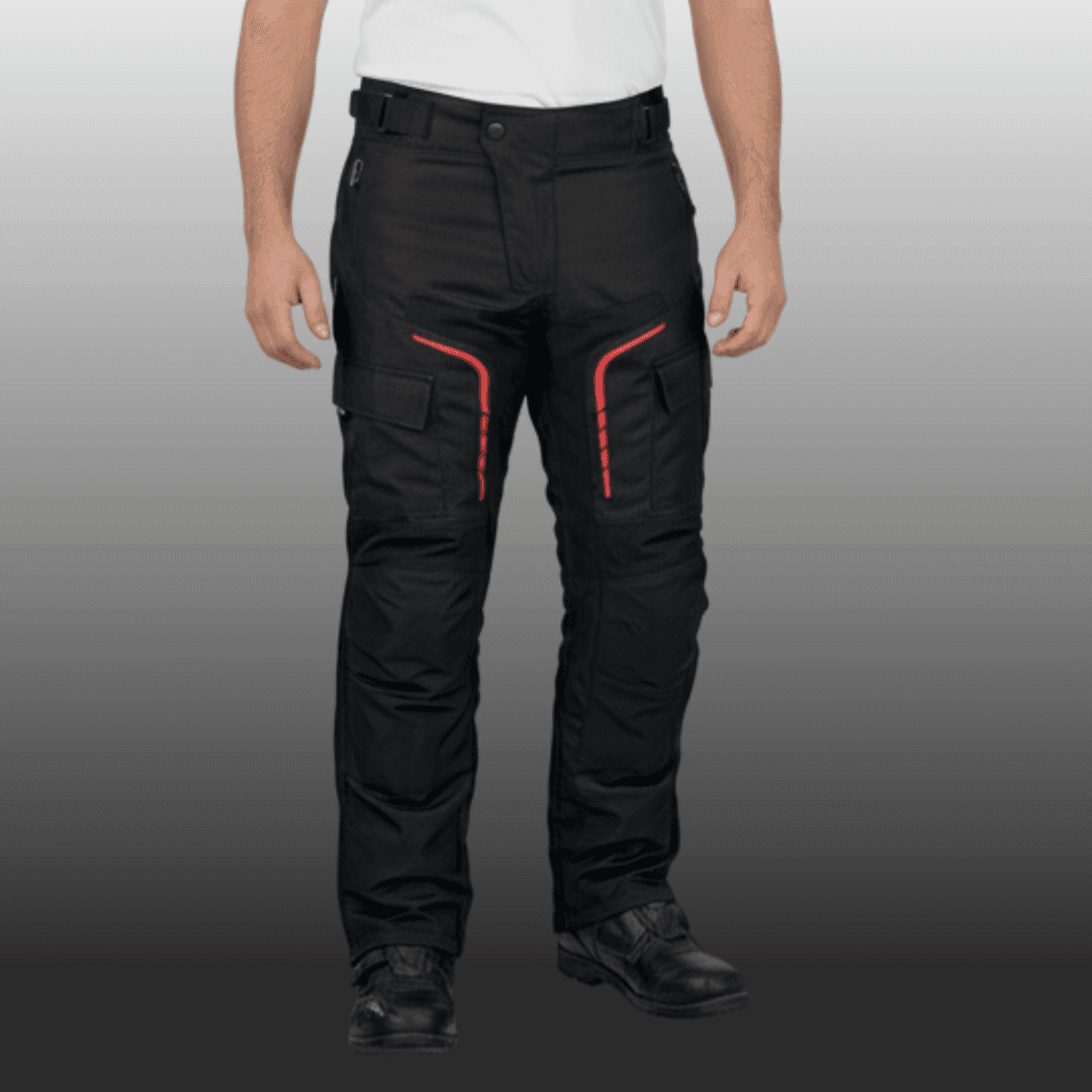 Man wearing black motorcycle pants with red detailing, pockets on the legs, and black protective boots.